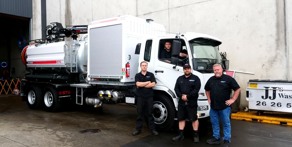The PS Equipment support team in front of an STG HDV6000 truck.